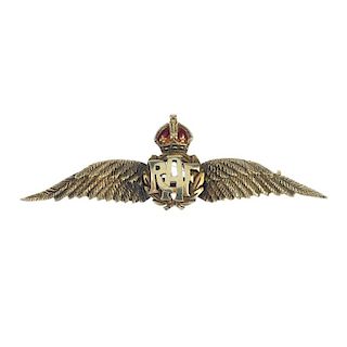 An early 20th century 15ct gold Royal Air Force badge. Designed as a wreath, with RAF centre, to the
