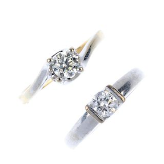 Two 18ct gold diamond single-stone rings. Each designed as a brilliant-cut diamond, one raised withi