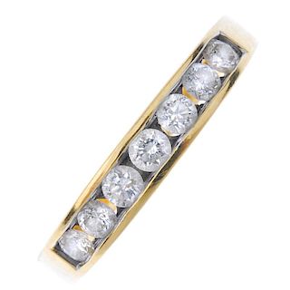 An 18ct gold diamond half-circle eternity ring. The brilliant-cut diamond line, within a channel set