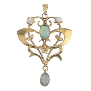 A 9ct gold opal and pearl pendant. Of openwork design, the oval opal cabochon collet, within a scrol
