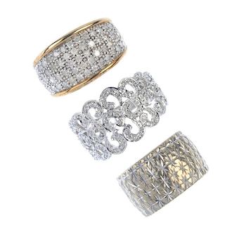 A selection of three 9ct gold rings. To include a diamond openwork scrolling ring, a diamond panel r