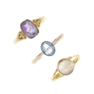 A selection of three gem-set rings. To include an early 20th century 18ct gold oval-shape aquamarine