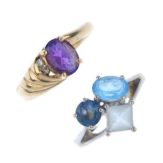 A selection of four 9ct gold gem-set rings. To include a vari-shade blue topaz dress ring, a citrine