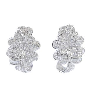 A pair of 18ct gold cubic zirconia earrings. Each designed as a four leaf clover, with ribbon detail
