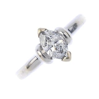 An 18ct gold diamond single-stone ring. The marquise-shape diamond, with curved bar sides and plain