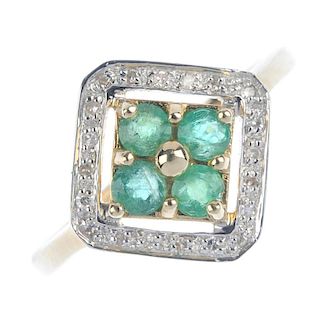 A 9ct gold emerald and diamond dress ring. The circular-shape emerald quatrefoil and bead highlight,