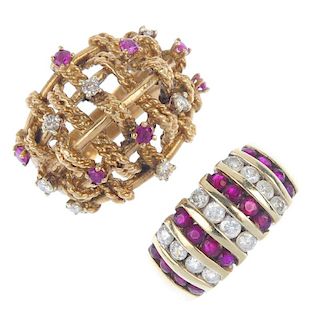 Two 9ct gold ruby and diamond dress rings. The first designed as an alternating series of circular-s