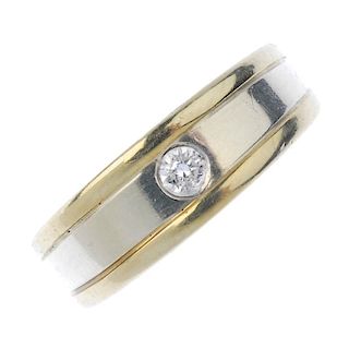 A diamond single-stone band ring. The brilliant-cut diamond, inset to the bi-colour, tapered band. E