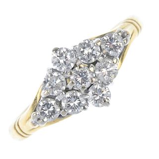 An 18ct gold diamond cluster ring. The brilliant-cut diamond stepped kite-shape cluster, to the trif
