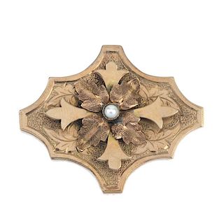 A late 19th century split pearl brooch. The raised cross, with split pearl centre and textured leaf