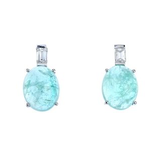 A pair of emerald and diamond earrings. Each designed as an oval emerald cabochon, with baguette-cut