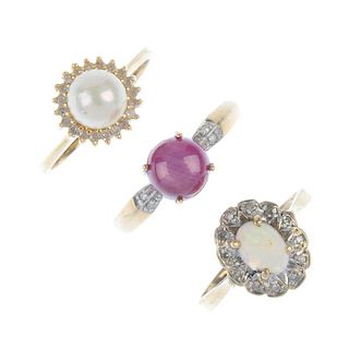 A selection of three diamond and gem-set rings. To include a 9ct gold circular ruby cabochon and dia