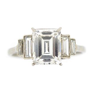A diamond single-stone ring. The rectangular-shape diamond, weighing 2.39cts, to the graduated bague