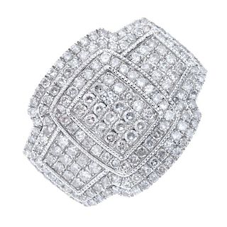 An 18ct gold diamond dress ring. The pave-set diamond panel and sides, within a series of single-cut