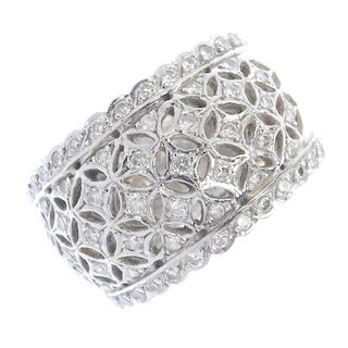 A diamond band ring. The brilliant-cut diamond lattice, to the similarly-cut diamond scalloped sides