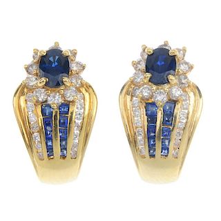 A pair of sapphire and diamond earrings. Each designed as an oval-shape sapphire and brilliant-cut d