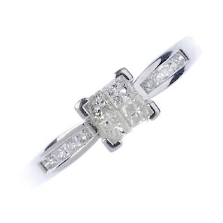 An 18ct gold diamond ring. The square-shape diamond quatrefoil, to the brilliant-cut diamond line sh