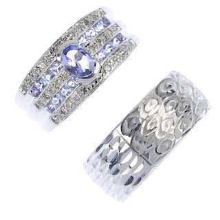 A selection of three rings. To include a 9ct gold tanzanite and diamond dress ring, a 9ct gold textu