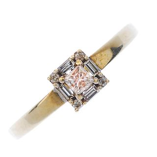 A 9ct gold diamond cluster ring. The square-shape diamond, within a brilliant-cut and rectangular-sh