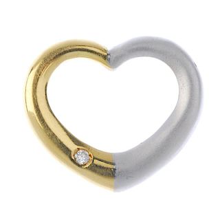 A diamond heart pendant. Of bi-colour design, the openwork heart, with brilliant-cut diamond highlig