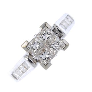An 18ct gold diamond dress ring. The square-shape diamond quatrefoil, to the similarly-cut diamond l