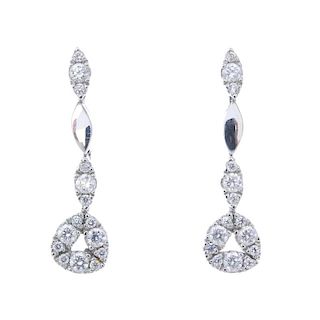 A pair of diamond ear pendants. Each designed as a brilliant-cut diamond cluster, suspended from an