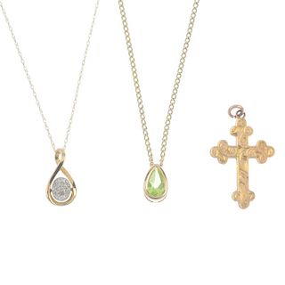 A selection of three pendants and nine chains. To include a diamond cluster scrolling pendant, a var