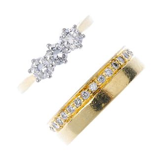 Two diamond rings. To include an 18ct gold brilliant-cut diamond three-stone ring, together with a b