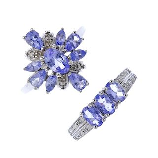Two gold tanzanite and diamond rings. To include a 14ct gold oval-shape tanzanite three-stone ring w