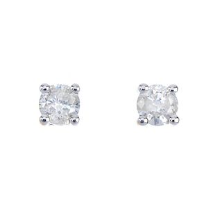 A pair of brilliant-cut diamond ear studs. Total diamond weight 0.25ct, stamped to mount, J-K, P2 cl