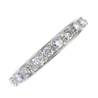 A diamond half-circle eternity ring. The brilliant-cut diamond line, to the grooved terminals and pl
