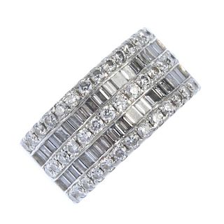 A platinum diamond five-row band ring. Designed as an alternating series of brilliant and baguette-c