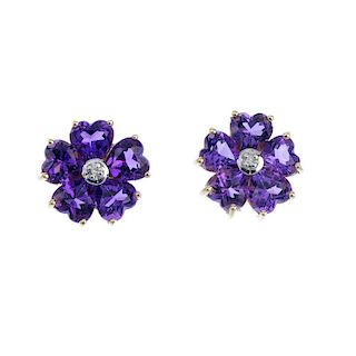 A pair of 9ct gold amethyst and diamond flower ear studs. Each designed as a single-cut diamond, wit