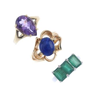 A selection of four gem-set rings. To include a 9ct gold emerald three-stone ring, a 9ct gold amethy