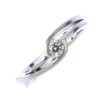 A diamond single-stone ring. The brilliant-cut diamond, to the openwork asymmetric band. Diamond wei