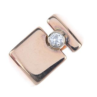 A 9ct gold diamond dress ring. The brilliant-cut diamond collet, to the rectangular-shape panel and