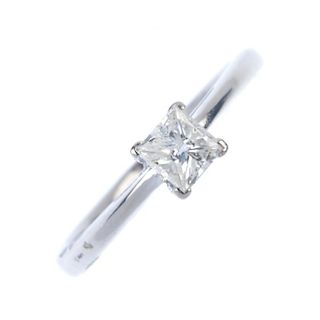 An 18ct gold diamond single-stone ring. The square-shape diamond, to the plain band. Diamond weight