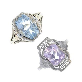 Two gem-set dress rings. The first designed as a fancy-shape aquamarine with openwork floral motif s