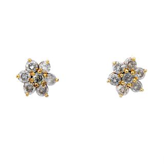 A pair of diamond cluster ear studs. Each designed as a brilliant-cut diamond floral cluster. Estima