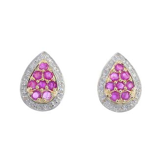 A pair of 9ct gold ruby and diamond cluster ear studs. Each of pear-shape outline, the circular-shap