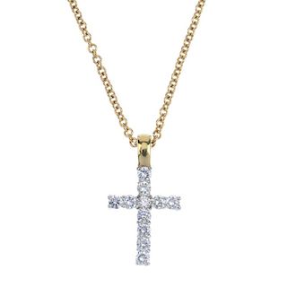 An 18ct gold diamond cross with chain. Of bi-colour design, the brilliant-cut diamond cross pendant,