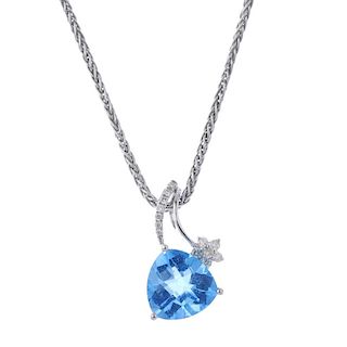 A topaz and diamond pendant. The triangular-shape blue topaz, to the brilliant-cut diamond floral su