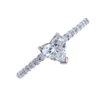 An 18ct gold diamond single-stone ring. The heart-shape diamond, weighing 0.56ct, to the brilliant-c