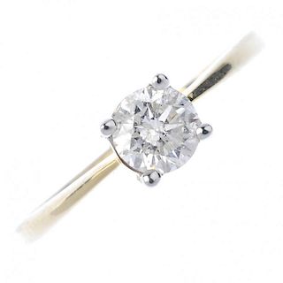 A 9ct gold diamond single-stone ring. The brilliant-cut diamond, to the tapered shoulders and plain