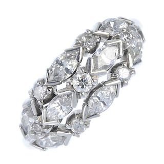 A diamond dress ring. Designed as three alternating brilliant and marquise-shape diamond lines, to t