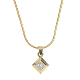 A diamond single-stone pendant. The kite-shape diamond, within a wide collet mount, suspended from a
