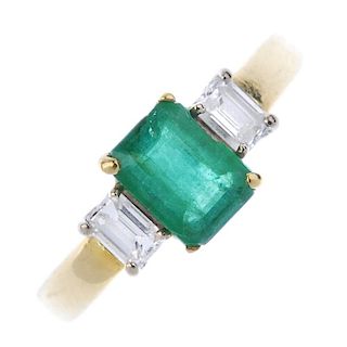 An 18ct gold emerald and diamond three-stone ring. The rectangular-shape emerald, to the rectangular