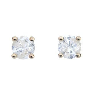A pair of brilliant-cut diamond ear studs. Total diamond weight 0.50ct, stamped to mount, estimated