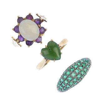 A selection of three 9ct gold gem-set rings. To include an emerald domed ring, an opal and amethyst