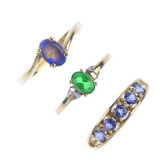 A selection of four gem-set rings. To include a 9ct gold tanzanite five-stone ring, a 9ct gold fire